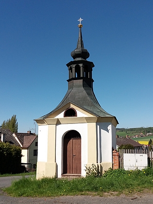 Kaple, zasvěcená původně sv. Janu Nepomuckému (od roku 1921 sv. Janu Křtiteli) v národnostně kdysi smíšené obci Prapořiště, kde učil více než dvacet let, než tam byla německá škola roku 1920 zrušena